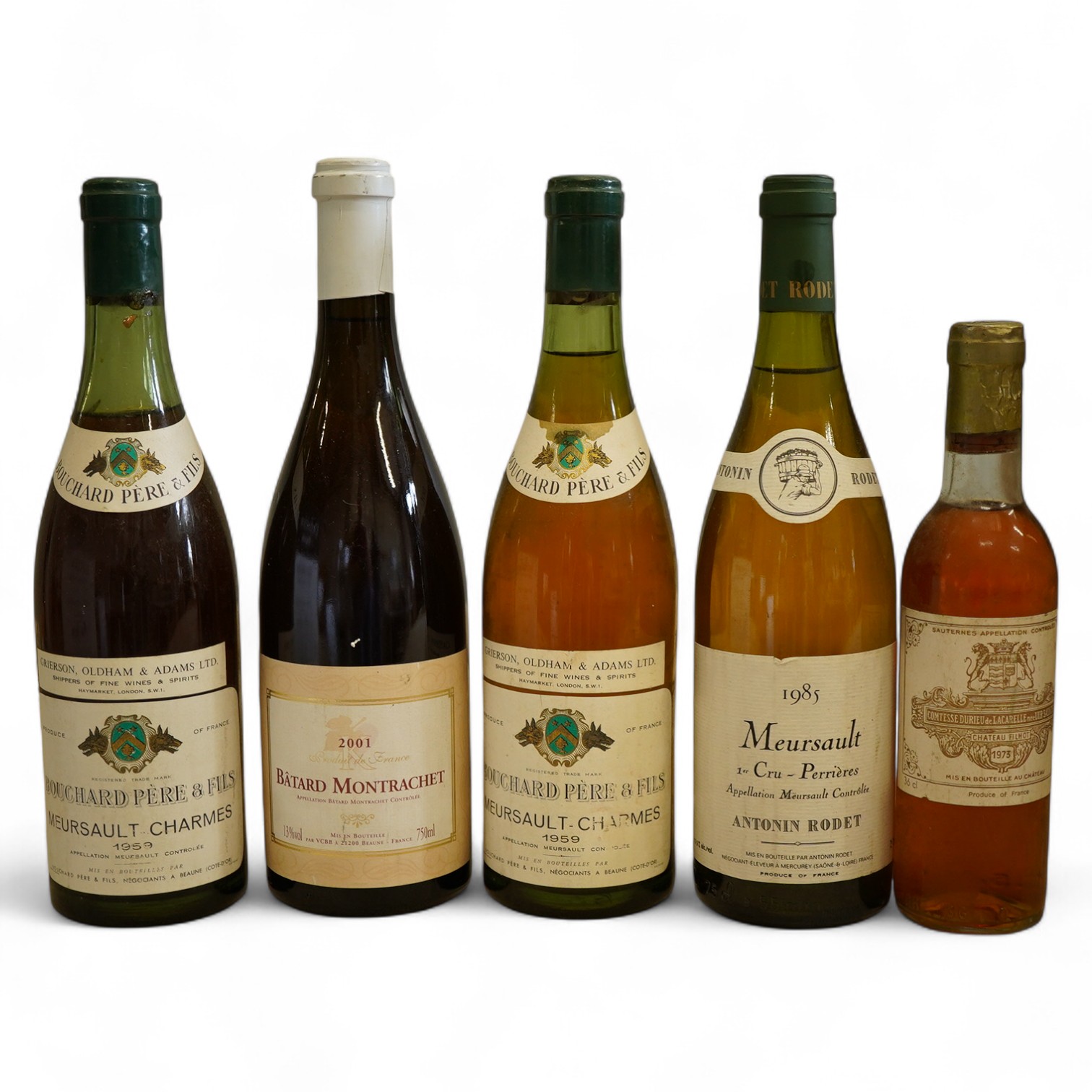 One bottle of 1985 Meursault 1er Cru, Antonin Rodet, one bottle of 2001 Batard Montrachet, two bottles of 1959 Meursault Charmes, Bouchard Pere & Fils and one half bottle of 1973 Chateau Filot, Sauternes. (5)